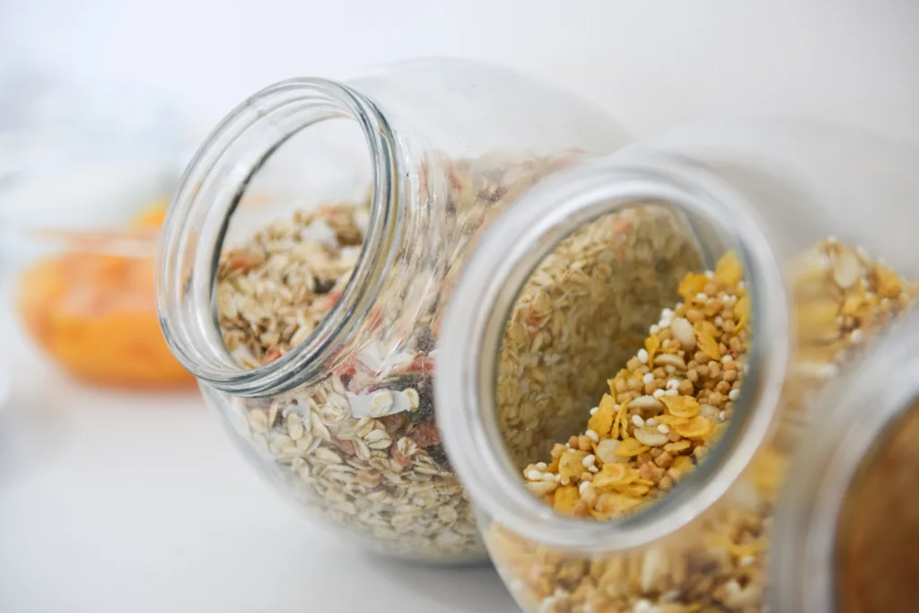 Glass jars of muesli and cereals on the breakfast buffet