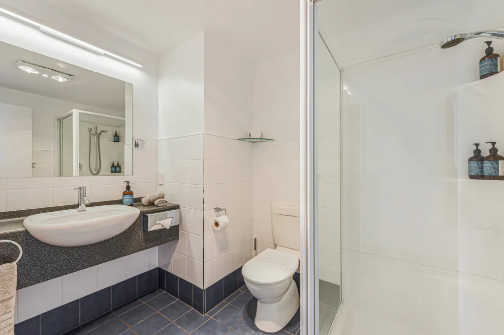 Bathroom with shower, vanity and Antipodes toiletries