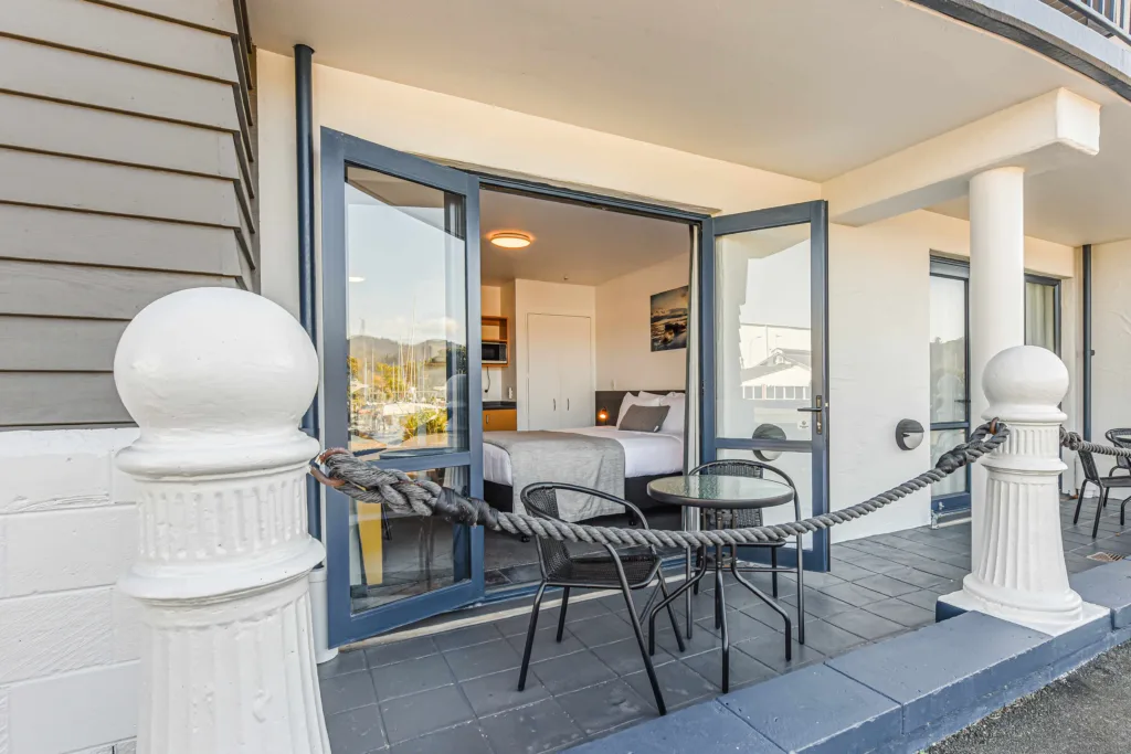 Ground-floor patio with outdoor table outside a Marina Front Studio