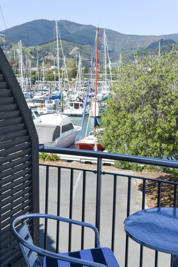 Balcony with bistro set overlooking Nelson Marina and the hills