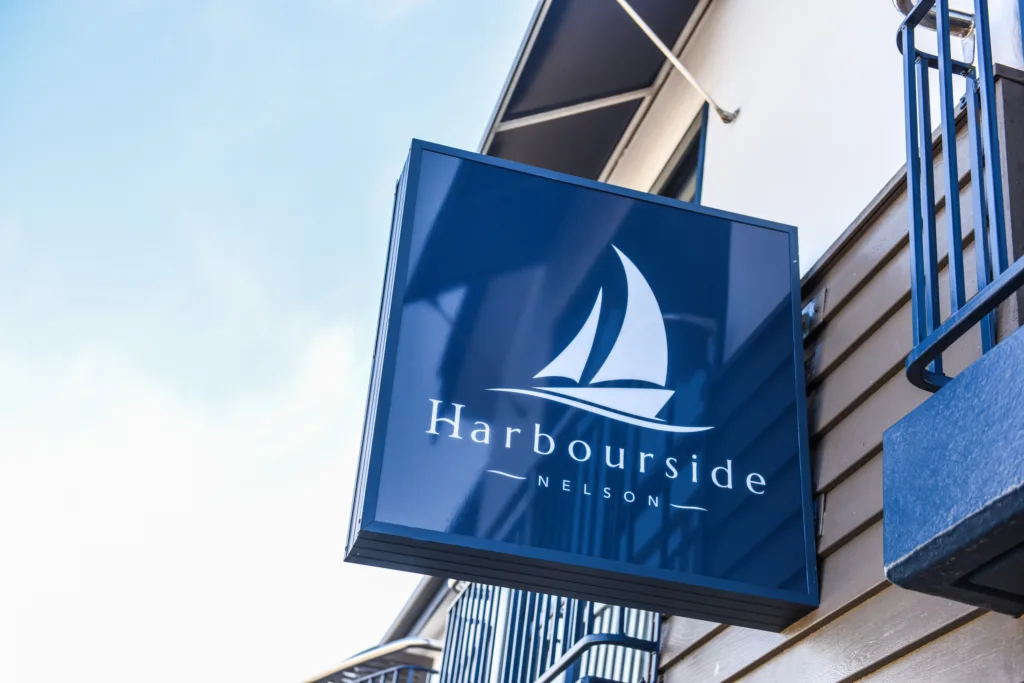 Illuminated Harbourside Nelson lightbox sign on the building